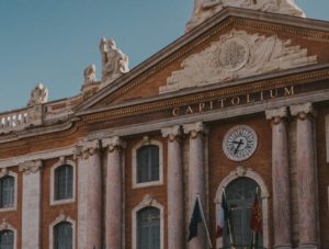 a church with a clock on the side of a building